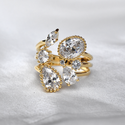 Gold Plated CZ Water Drops Open Ring - Waterproof. Indulge in the luxurious beauty! With its waterproof design, this ring will be a stunning addition to your jewellery collection. The sparkling CZ water drops add a touch of glamour to any outfit.